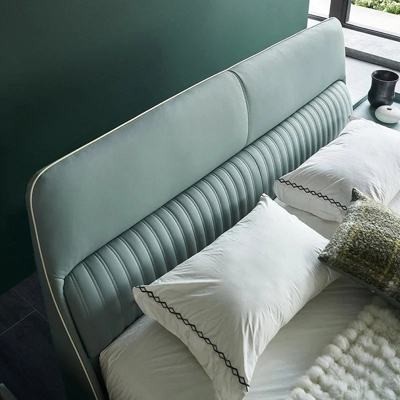 A bed with mattress ice green colour