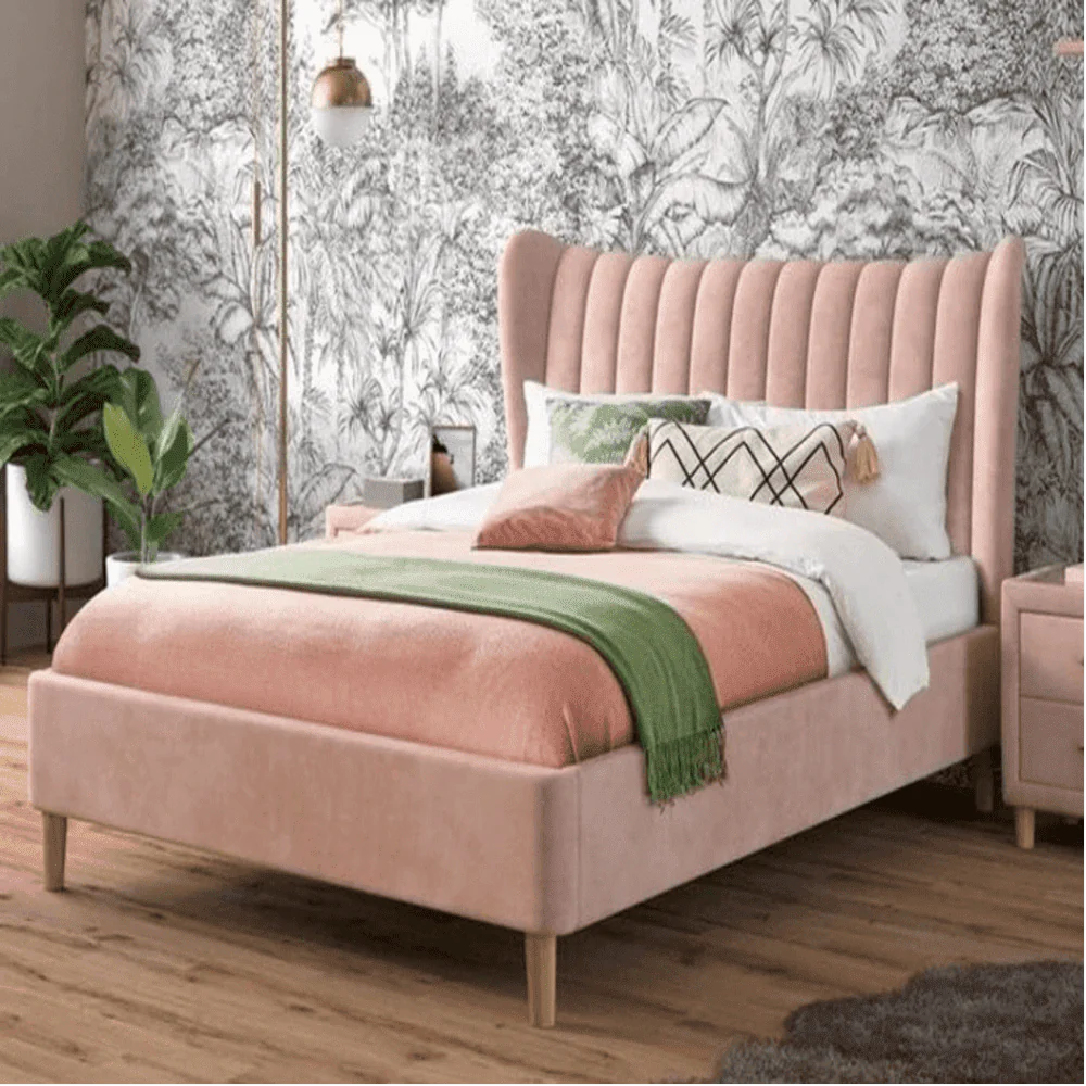 A bed with mattress pink colour