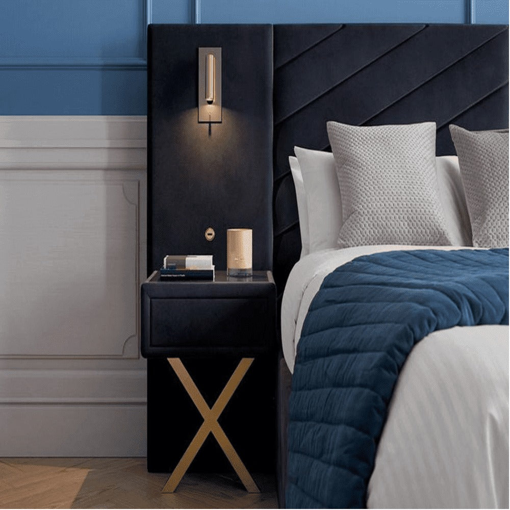 A bed with mattress navy blue colour