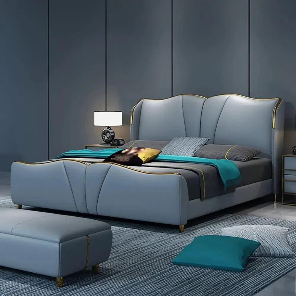 A bed with mattress sky blue gold colour