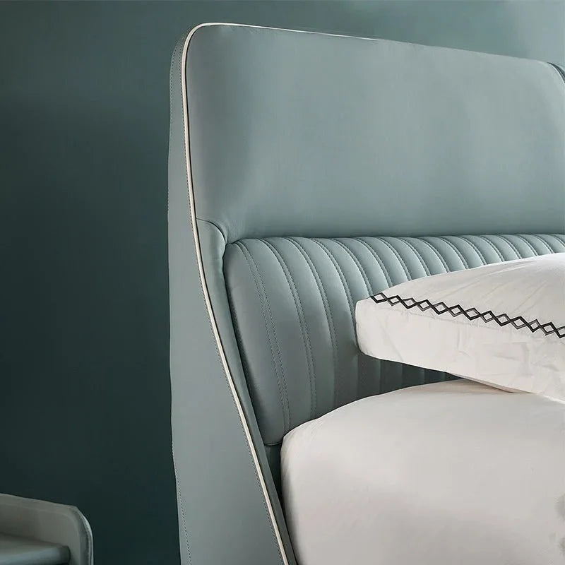 A bed with mattress ice green colour