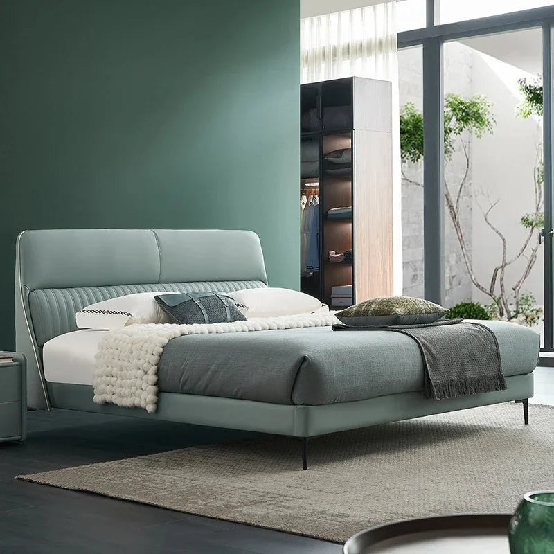 A bed with mattress ice green colour