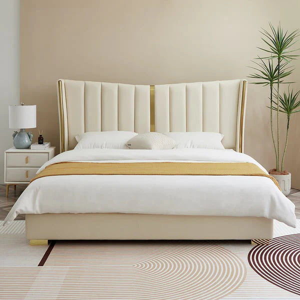 A bed with matress white and gold colour